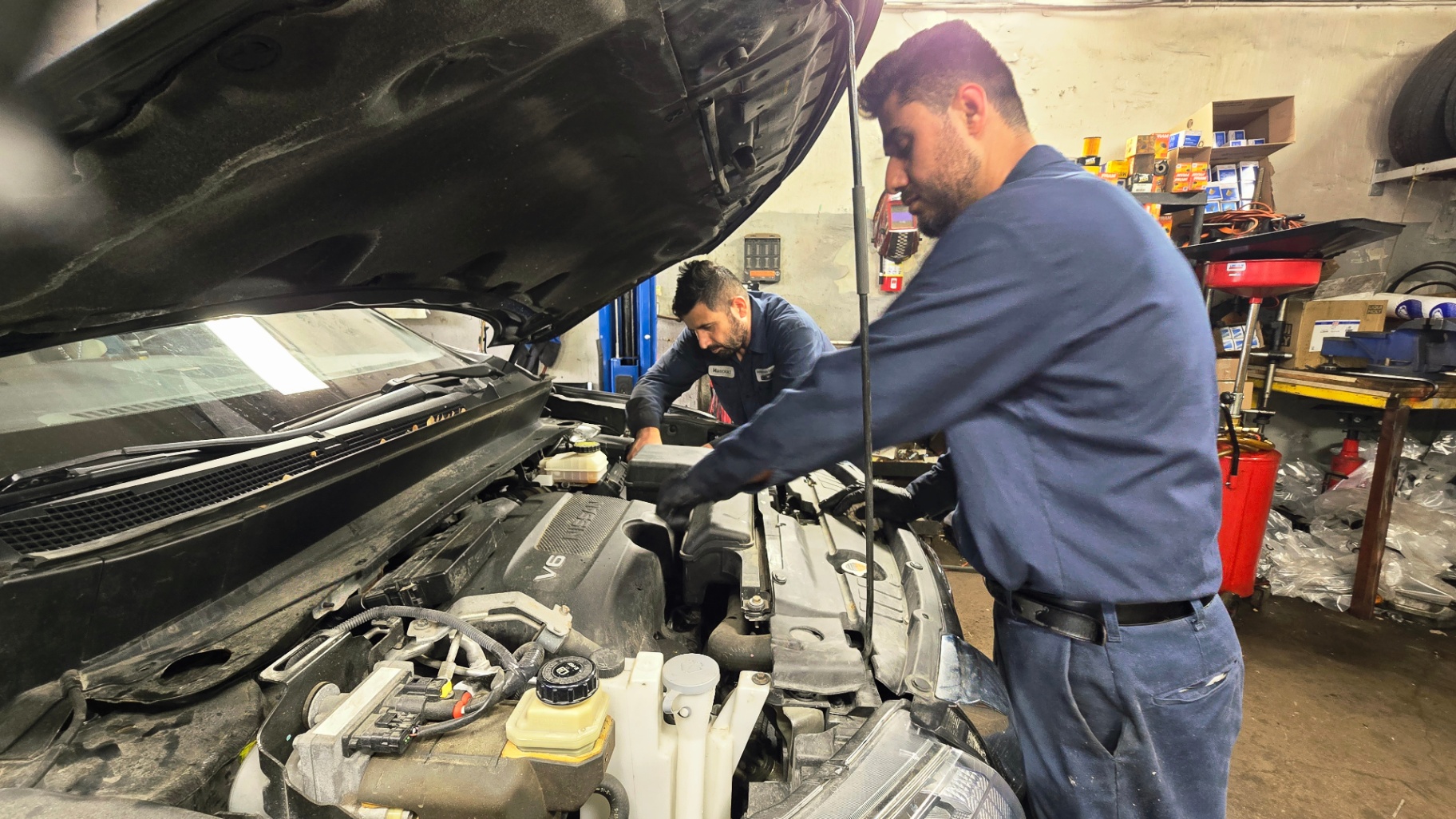 Southside mechanics servicing a V6 engine