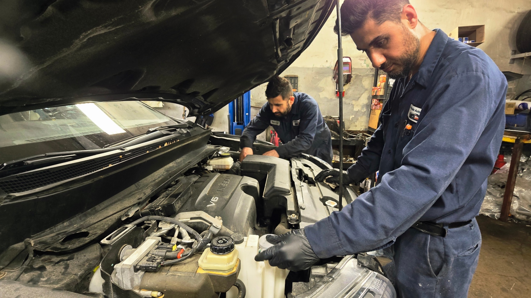 Mechanic working on an engine at Southside Auto Centre
